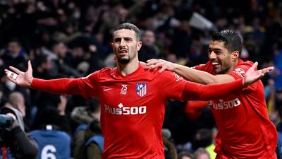 Mario Hermoso (left) celebrates with Luis Suarez after scoring the winner for Atletico Madrid against Valencia on Saturday Creator: PIERRE-PHILIPPE MARCOU