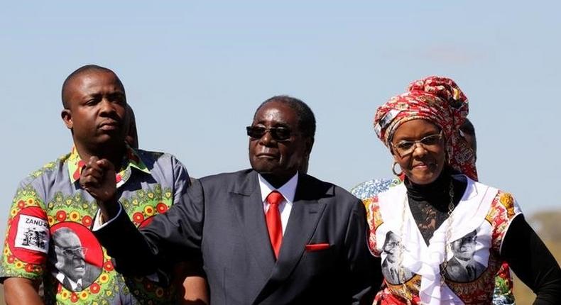 Zimbabwe's President Robert Mugabe and his wife Grace greet supporters of his ZANU (PF) party during the One Million Man March, a show of support of Mugabe's rule in Harare, Zimbabwe, May 25, 2016. 