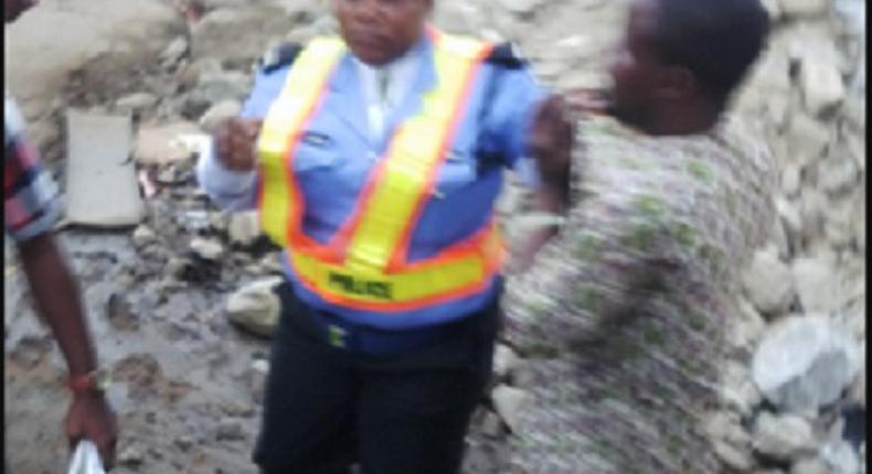 A policewoman dealing with a danfo driver