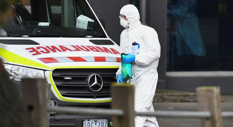 An ambulance is seen outside one of nine public housing estates locked down due to a spike in COVID-19 coronavirus numbers in Melbourne