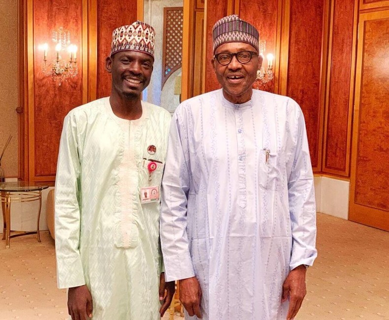 Bashir Ahmad poses in a photograph with Muhammadu Buhari. [Presidency]