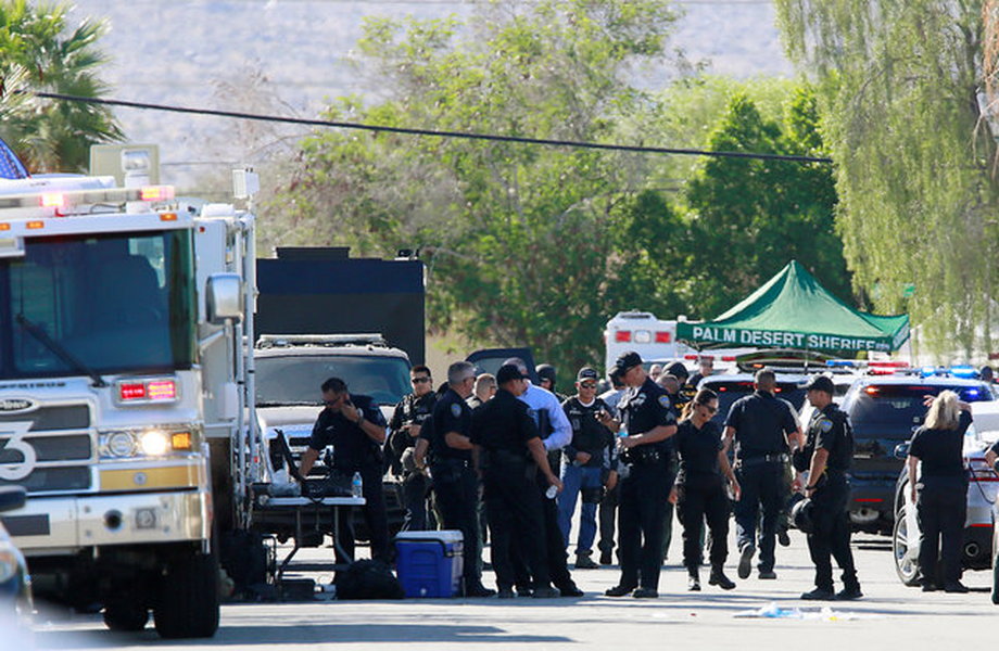 Police officers from various agencies are shown at their command center during a standoff where three officers were shot by a suspect in Palm Springs, California, U.S. October 8, 2016.