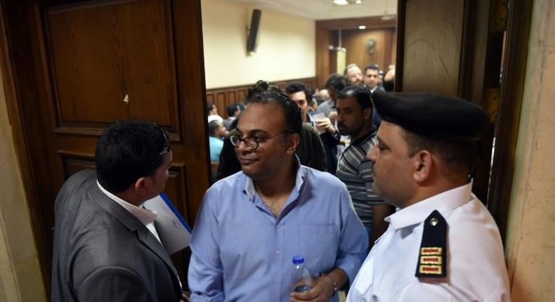 Renowned human rights activist Hossam Bahgat (C), seen here leaving a courtroom in Cairo in April, is one of five whose assets have been seized following a lengthy legal process