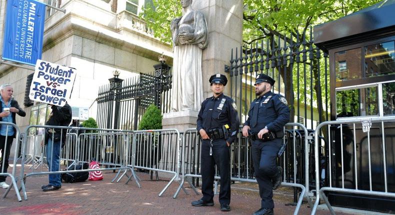 NYPD officers stand near the entrance of Columbia University on May 1, 2024.CHARLY TRIBALLEAU/Getty Images