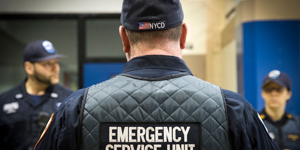 Corrections officers work in the Enhanced Supervision Housing Unit at the Rikers Island Correctional facility in New York March 12, 2015.