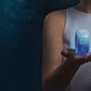 Futuristic unrecognizable woman holding smartwatch on a cosmic background