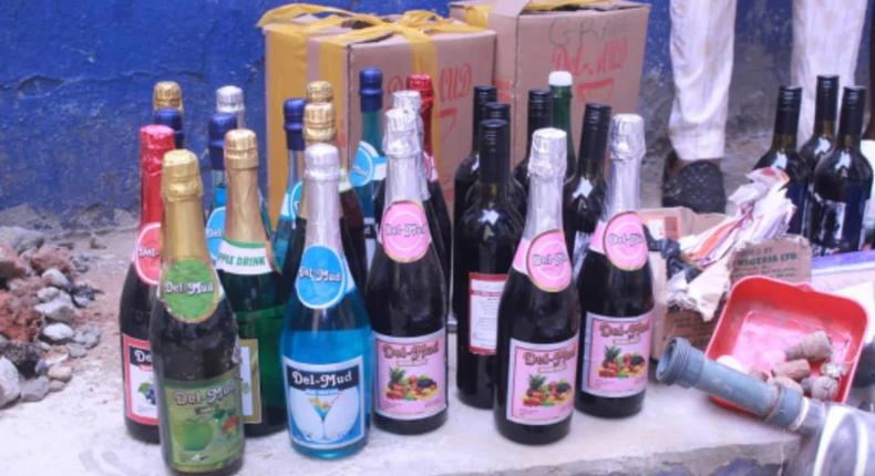 The evidence includes unlabeled and branded bottles of suspected adulterated alcoholic drinks [NAN]