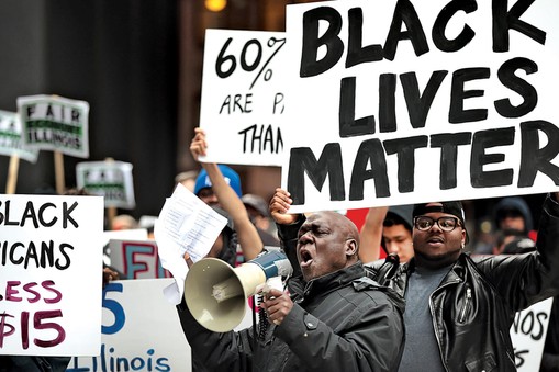 Black Lives Matter Protesters Join Living Wage Activists For Rally And March In Chicago