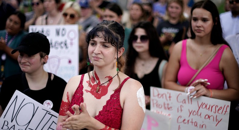 Abortion-rights advocates gather outside a the Kansas Statehouse to protest the Supreme Court's ruling on abortion Friday, June 24, 2022, in Topeka, Kansas.