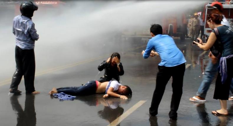 Cambodia police use water cannon to break up textiles strike