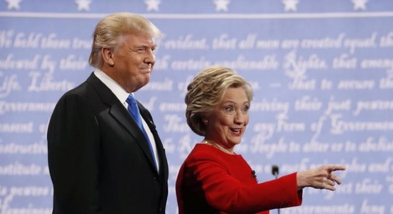 Republican U.S. presidential nominee Donald Trump and Democratic U.S. presidential nominee Hillary Clinton look on at the start of their first presidential debate at Hofstra University in Hempstead, New York, U.S., September 26, 2016.  