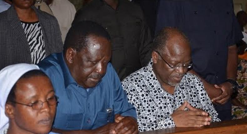 A file photo of Raila Odinga with Tanzanian John Magufuli (right)
