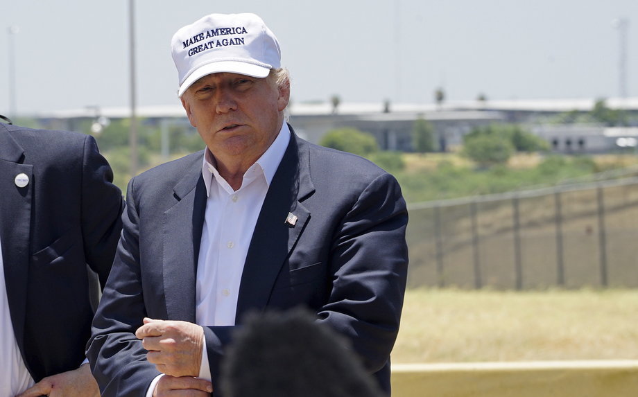 Republican presidential candidate Donald Trump attends a news conference with the US-Mexico border in the background, outside Laredo, Texas.