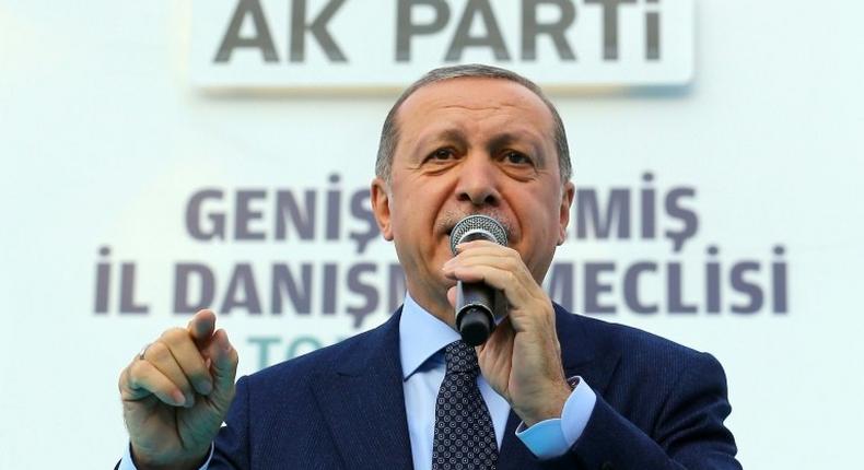 Turkish President Recep Tayyip Erdogan addresses supporters during a rally of his Justice and Development Party (AKP) in Denizli, on August 19, 2017