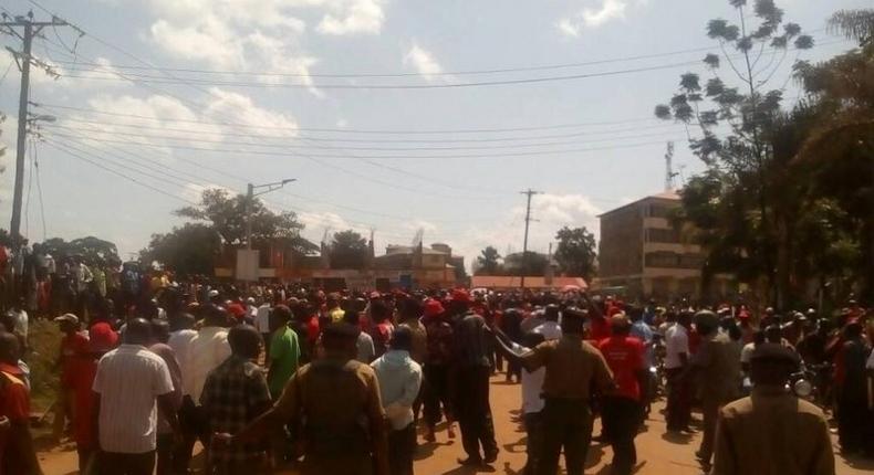 Armed police officers separate supporters of Kenneth Lusaka and Wycliffe Wangamati when they clashed in Bungoma town, June 2, 2017.