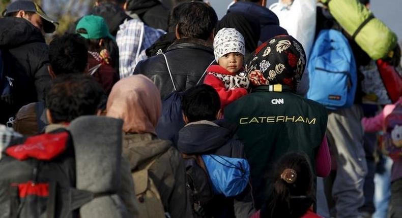 Migrants wait to enter a transit camp after entering the country by crossing the border with Greece in Gevgelija, Macedonia, November 10, 2015. 