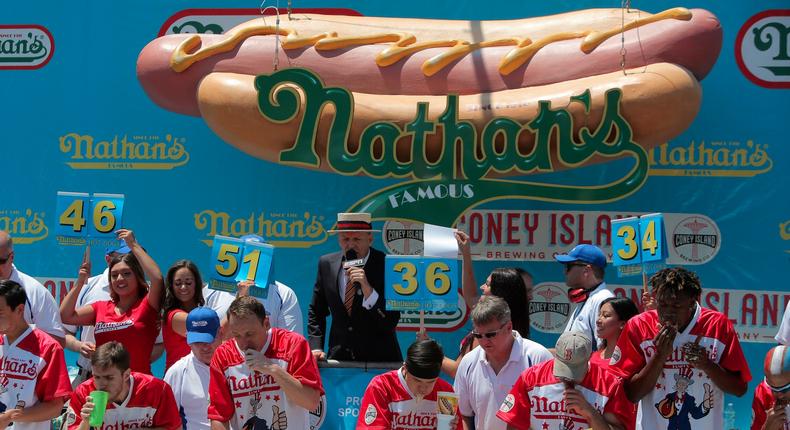 People compete in Nathan's Famous Fourth of July International Hot Dog-Eating Contest at Coney Island.