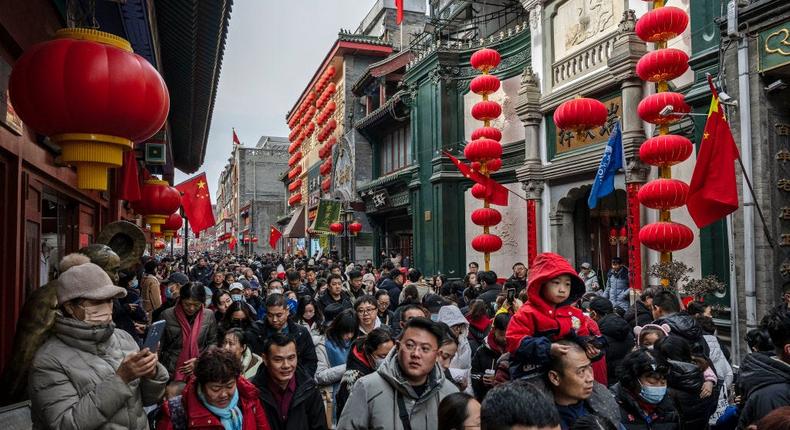 People in a pedestrian shopping street in Beijing, China.Kevin Frayer/Getty Images