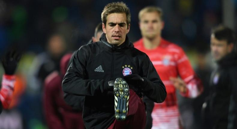 Bayern Munich defender Philipp Lahm warms up prior to the UEFA Champions League match against FC Rostov at Rostov-on-Don's Olimp 2 stadium in Rostov-on-Don, Russia on November 23, 2016