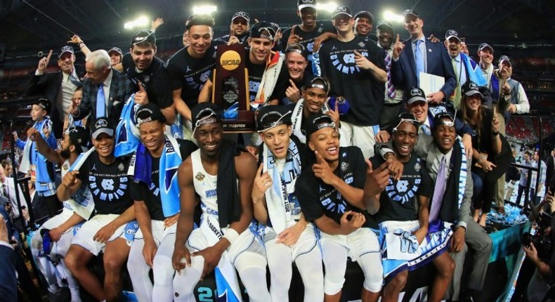 The North Carolina Tar Heels celebrate after defeating the Gonzaga Bulldogs during the 2017 NCAA Men's Final Four National Championship game, at University of Phoenix Stadium in Glendale, Arizona, on April 3