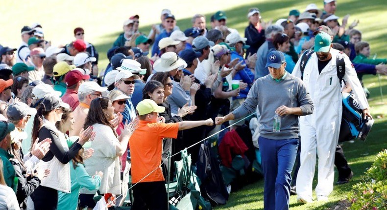 Apr 9, 2016; Augusta, GA, USA; Jordan Spieth greets fans as he walks to the 6th green during the third round of the 2016 The Masters golf tournament at Augusta National Golf Club. Mandatory Credit: Rob Schumacher-USA TODAY Sports