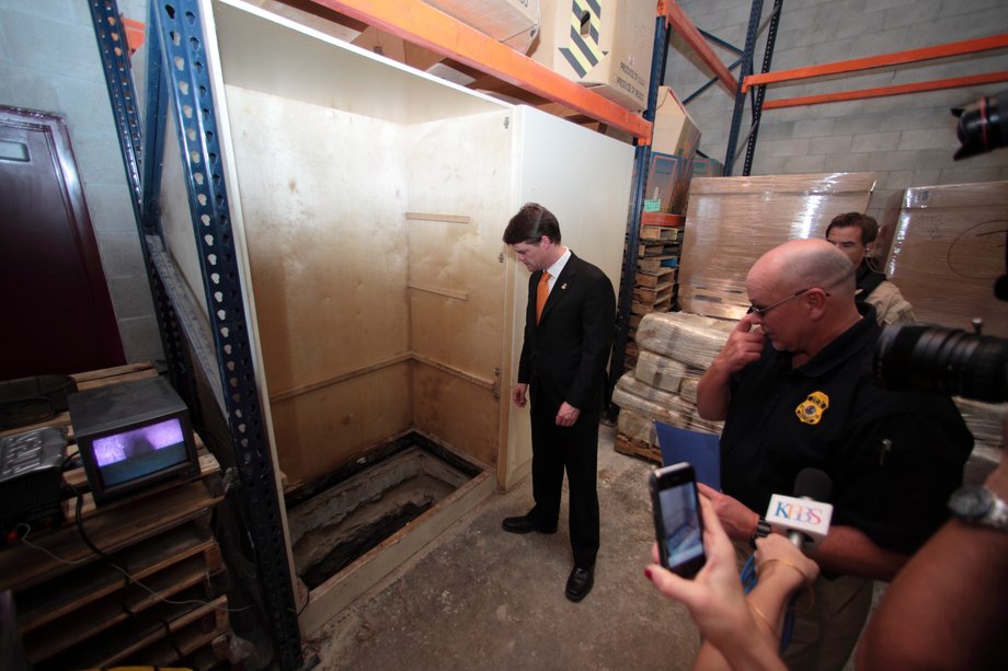 John Morton, director of the US Immigration and Customs Enforcement, stands near the entrance to a cross-border tunnel found in Otay Mesa, California, November 3, 2010.