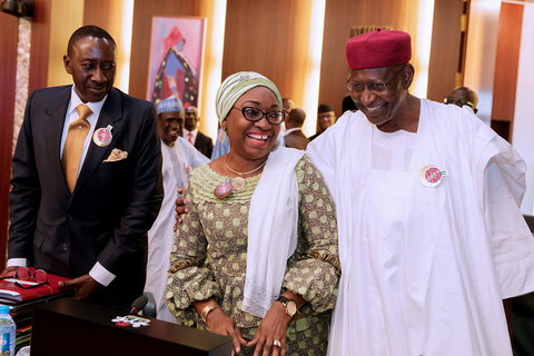 Head of Service, Mrs Winifred Oyo-Ita (left) and Chief of Staff, Abba Kyari (right) reconcile at Federal Executive Council (FEC) meeting after a heated debate days earlier. Looking on is NSA Monguno (far left). 