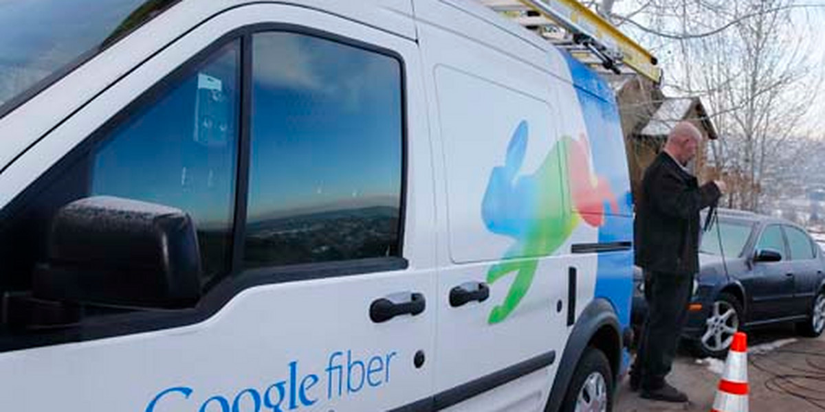A technician gets cabling out of his truck to install Google Fiber in a residential home in Provo, Utah, January 2, 2014.