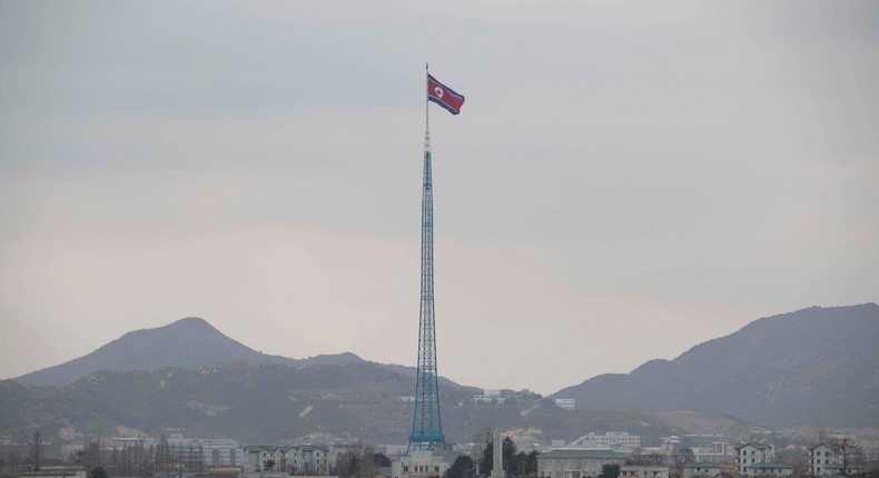 A North Korean national flag in North Korea's propaganda village of Gijungdong is seen from a South Korea's observation post inside the demilitarized zone (DMZ) separating South and North Korea on March 03, 2023 in Panmunjom, South Korea.Jeon Heon-Kyun - Pool/Getty Images