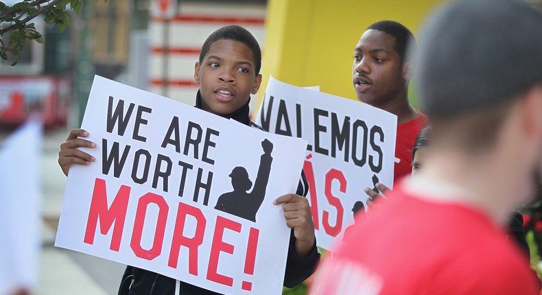 Fast food workers and activists demonstrate outside McDonald's downtown flagship restaurant on July 31, 2014 in Chicago, Illinois.