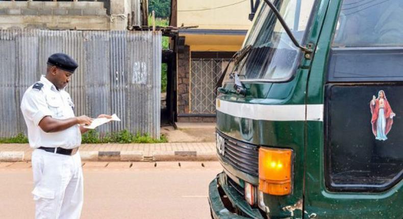 Traffic police officer stops a truck to check for EPS defaulting