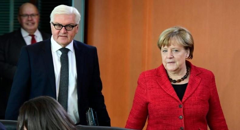 German Chancellor Angela Merkel and Foreign Minister Frank-Walter Steinmeier arrive for the weekly cabinet meeting in Berlin on November 9, 2016