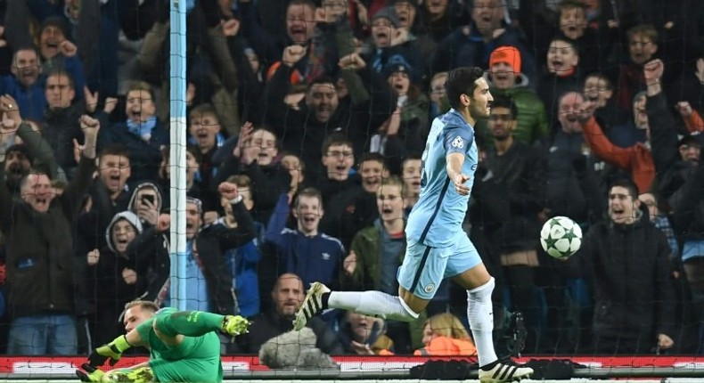 Manchester City's Ilkay Gundogan celebrates scoring his team's third goal during the match against Barcelona in Manchester on November 1, 2016