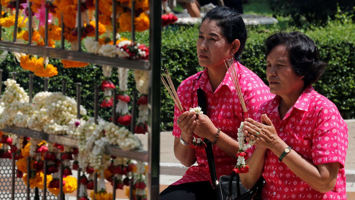 Well-wishers wear pink shirts as they pray for Thailand's King Bhumibol Adulyadej at Siriraj Hospital in Bangkok