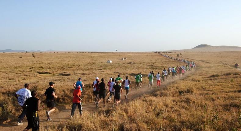 Runners compete in the Lewa marathon and half-marathon, held in the Safaricom conservancy in Kenya's Laikipia district, on June 28, 2014. (PHIL MOORE/AFP via Getty Images)
