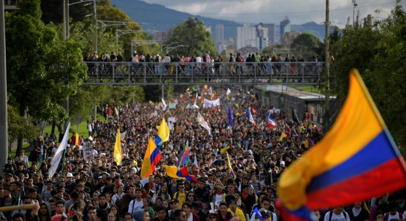 Tens of thousands march against the government of Colombian President Ivan Duque during a national strike in Bogota Wednesday