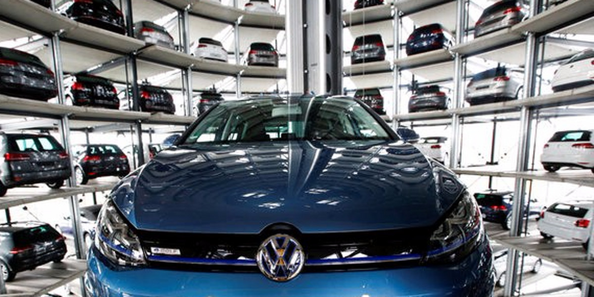 A Volkswagen Golf car is loaded in a delivery tower at the plant of German carmaker in Wolfsburg