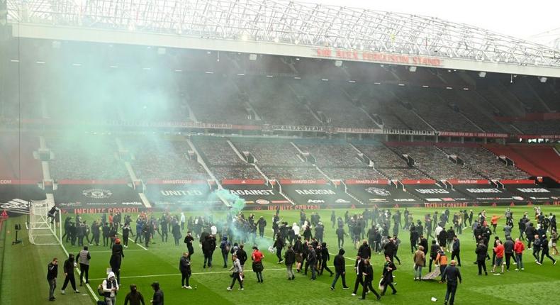 Supporters protesting against Manchester United's owners invaded the pitch at Old Trafford Creator: Oli SCARFF