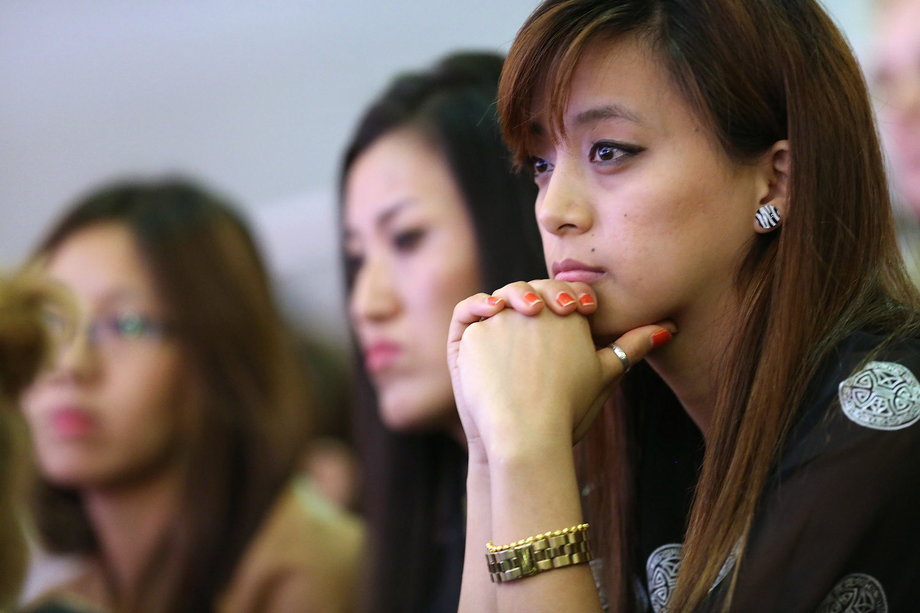 Asian-American students listen to the Dalai Lama speak at Hunter College.