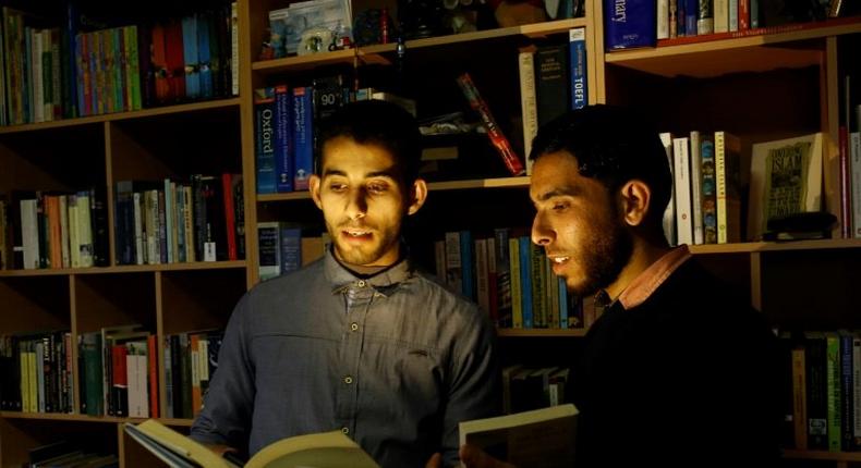 Mossab Abo Toha (L) and his friend Shafi Salem, want to open the first English-language library in the beleaguered Palestinian territory