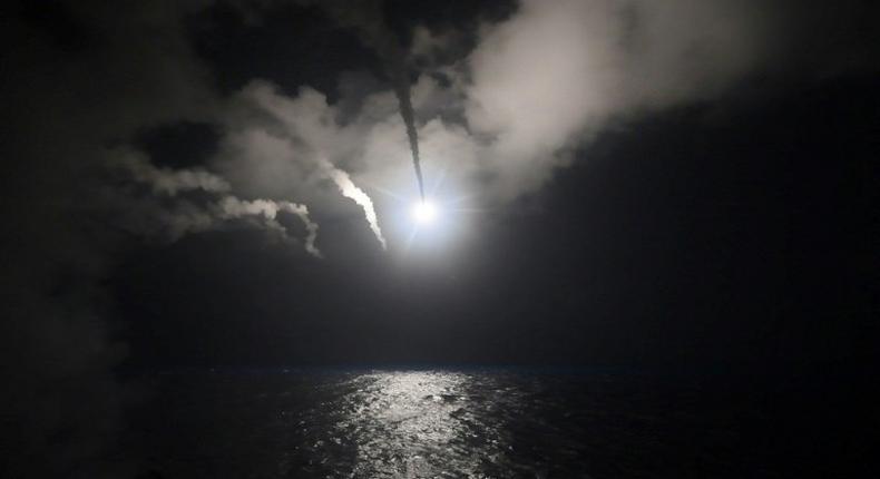 Image released by the US Navy shows the USS Porter launching cruise missiles at a Syrian airbase from the Mediterranean early on April 7, 2017