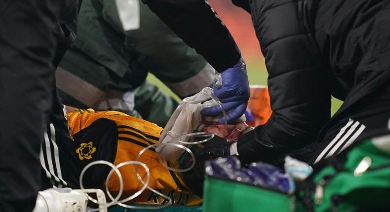 Wolves forward Raul Jimenez receives treatment after a clash of heads with Arsenal's David Luiz