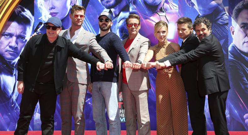 Marvel Studios President Kevin Feige, from left, poses with members of the cast of