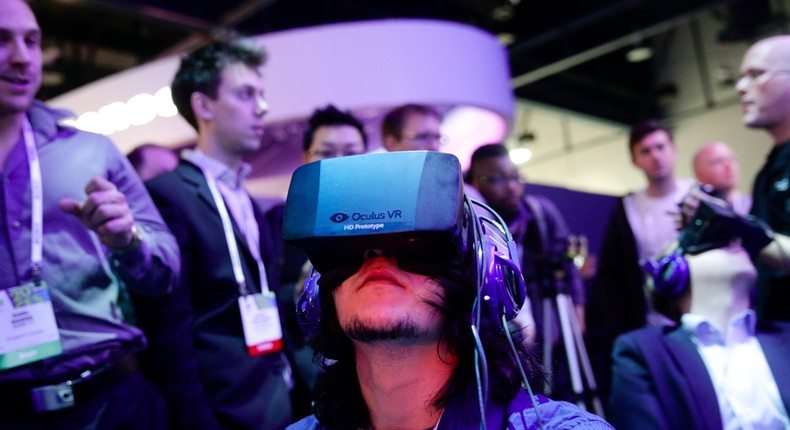 A man demos an early Oculus Rift prototype headset at the Consumer Electronics Show in Las Vegas.