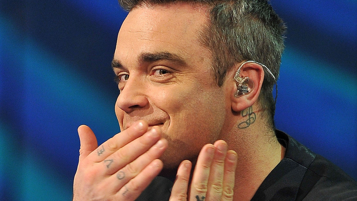 Robbie Williams nie spodziewał się takiej reakcji na swoją nową piosenkę. Artysta zaśpiewał ją swojej 5-miesięcznej córeczce, a ona...zwymiotowała.