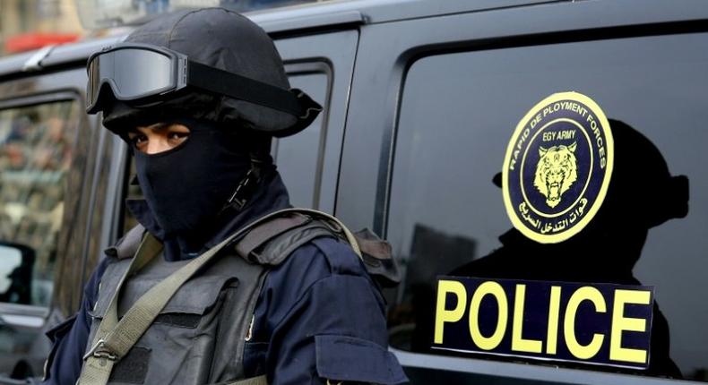 An Egyptian policeman stands guard on Cairo's landmark Tahrir Square on January 25, 2017