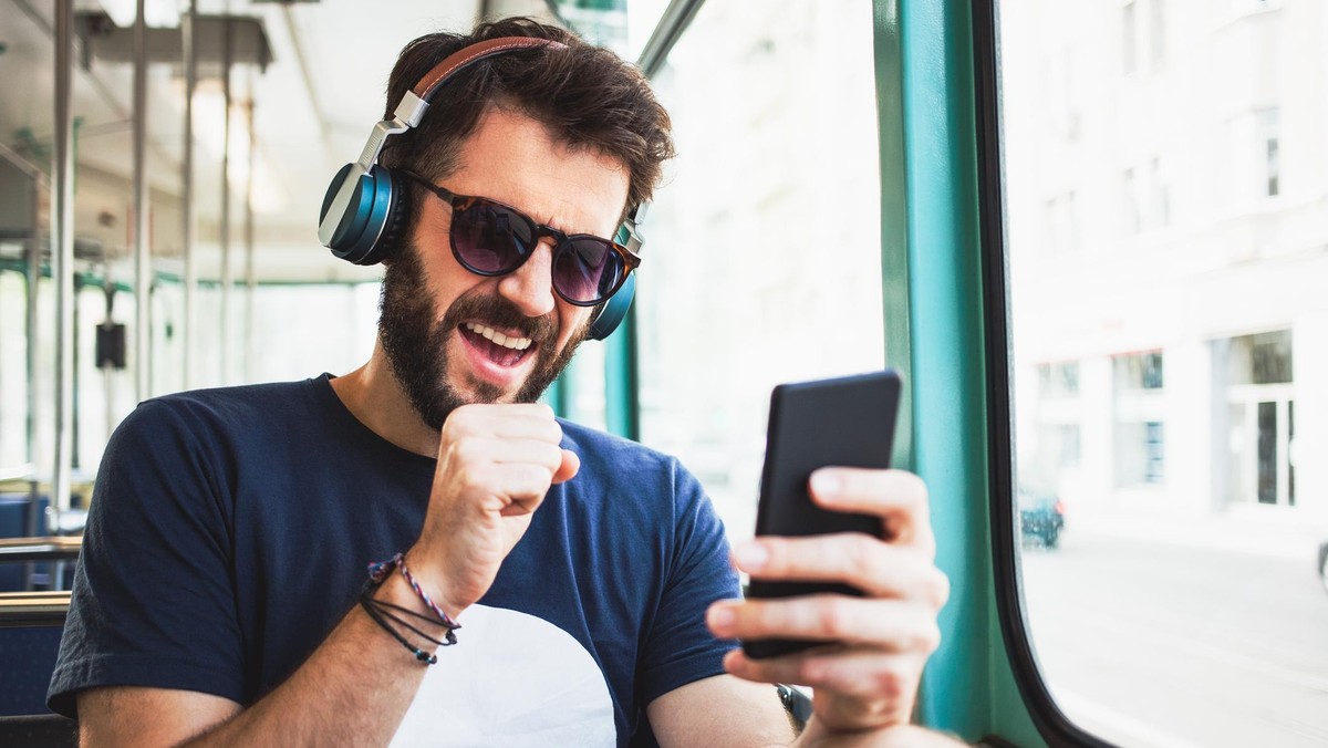 Young commuter listening to the music