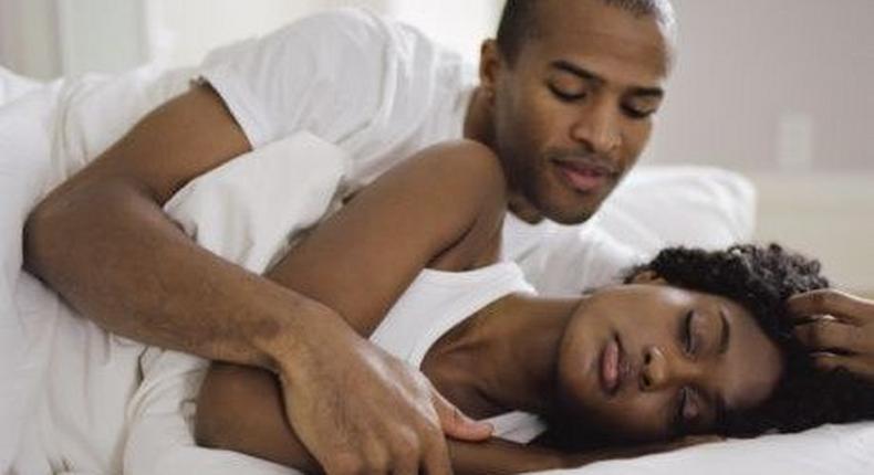 Black couple in bed