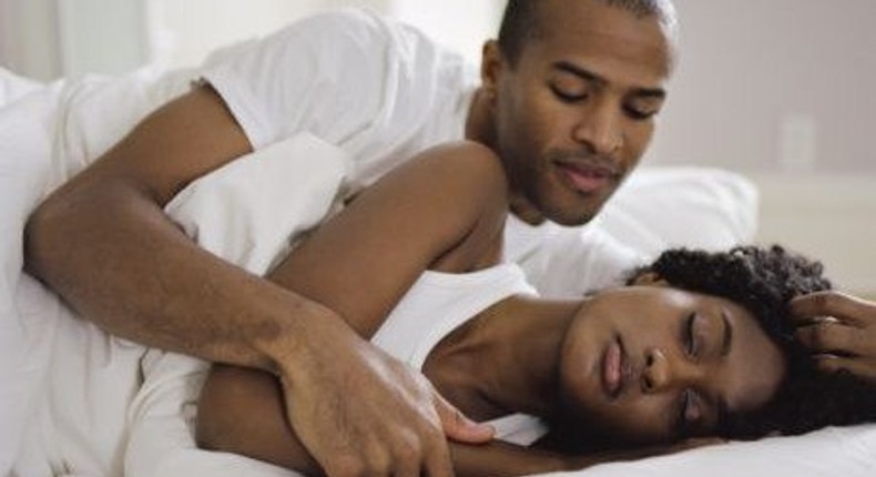 Black couple in bed