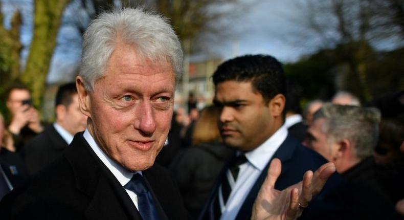 Former US President Bill Clinton speaks to mourners after the funeral of former Northern Ireland Deputy First Minister Martin McGuinness at St Columba's Church Long Tower, in Derry, Northern Ireland on March 23, 2017